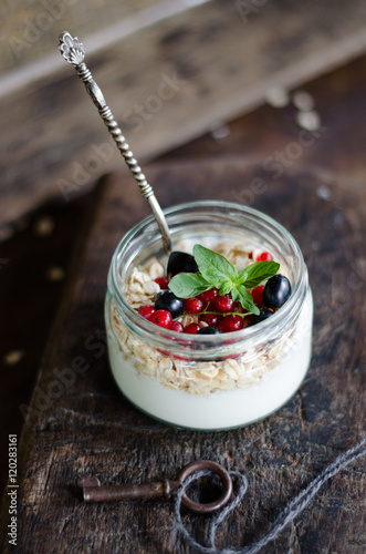 yogurt with berries and products for healthy breakfast, close-up
