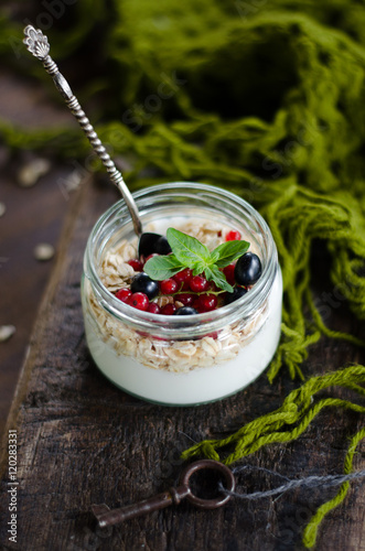 yogurt with berries and products for healthy breakfast, close-up
