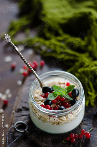 yogurt with berries and products for healthy breakfast, close-up
