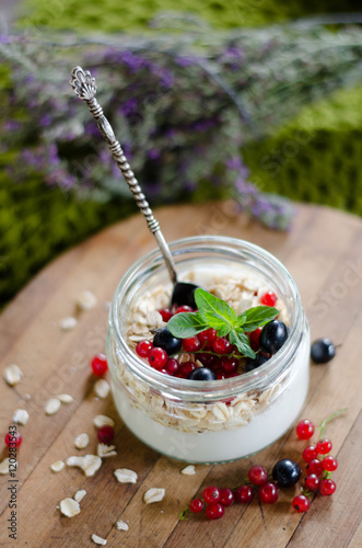 yogurt with berries and products for healthy breakfast, close-up
