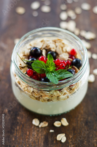 yogurt with berries and products for healthy breakfast, close-up
