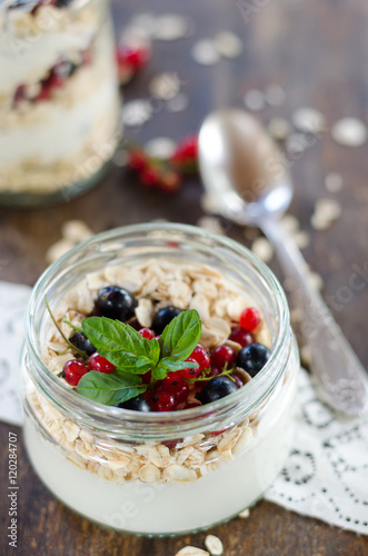 yogurt with berries and products for healthy breakfast, close-up
