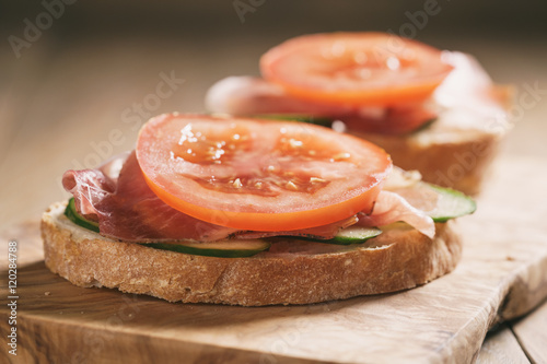 ciabatta open sandwiches with speck and vegetables