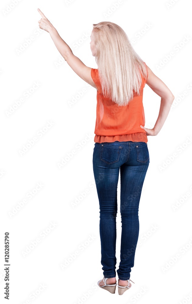 Back view of pointing woman. beautiful blonde girl in jeans. Rear view people collection. backside view of person. Isolated over white background. Back view of pointing woman. beautiful blonde girl in jeans. Rear view people collection. backside view of person. Isolated over white background.