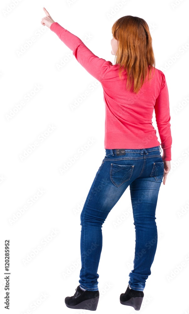 Back view of pointing woman. beautiful blonde girl in jeans. Rear view people collection. backside view of person. Isolated over white background. Back view of pointing woman. beautiful blonde girl in jeans. Rear view people collection. backside view of person. Isolated over white background.