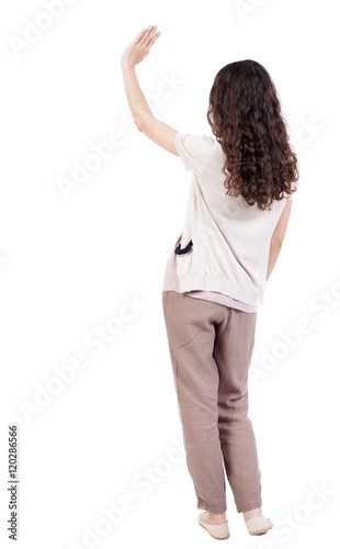 Billede på lærred Back view of curly woman welcomes