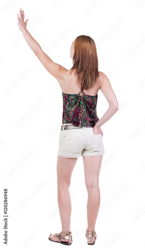 Back view of beautiful woman welcomes. Young teenager girl in shorts hand waving from. Rear view people collection. backside view of person. Isolated over white background. Back view of beautiful woman welcomes. Young teenager girl in shorts hand waving from. Rear view people collection. backside view of person. Isolated over white background.