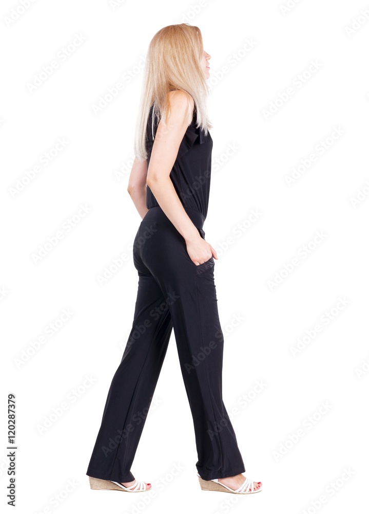 back view of walking woman. beautiful blonde girl in motion. backside view of person. Rear view people collection. Isolated over white background. back view of walking woman. beautiful blonde girl in motion. backside view of person. Rear view people collection. Isolated over white background.