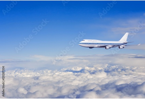 passenger airplane in the clouds. travel by air transport. flying to the top of the airliner. nobody