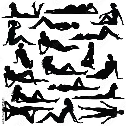 Silhouette of beautiful woman in bikini sitting and laying.