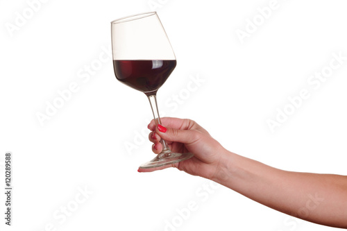 female hand with red wine glass