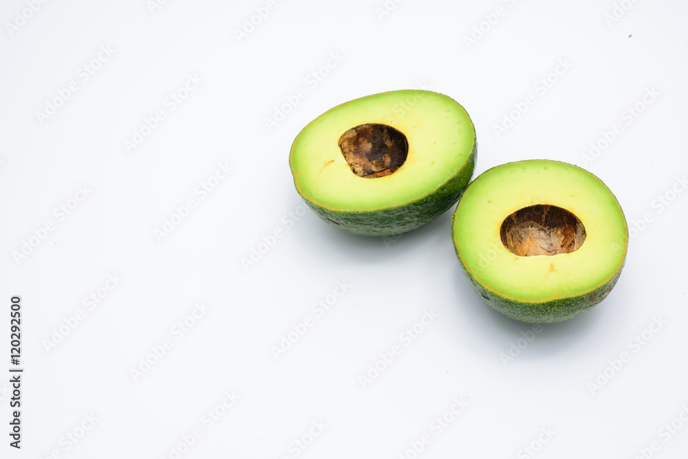 Half of green avocados isolated on a white background