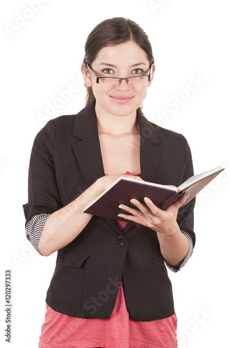 portrait of pretty female teacher wearing glasses and holding book