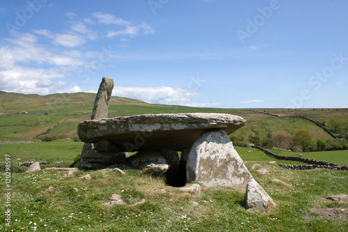 Cairn Holy Chambered Cairn, near Wigtown - Dumfries and Galloway. Neolithic burial chamber in Scotland. Bright sunny day, blue sky. photo
