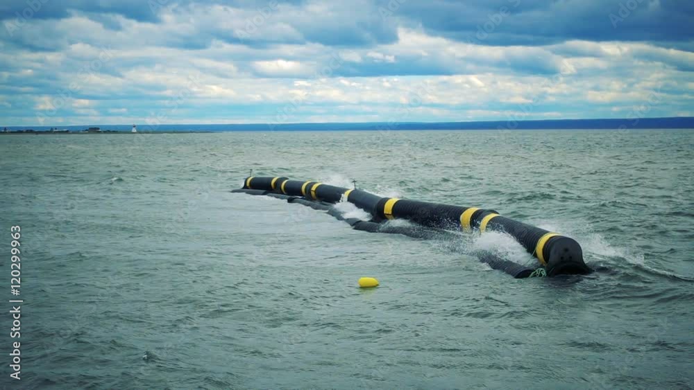 Wave-Break System Working in Slow Motion in the Ocean to Protect a Marina