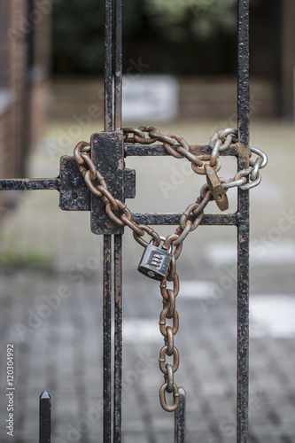 A locks and chains on two metal gates