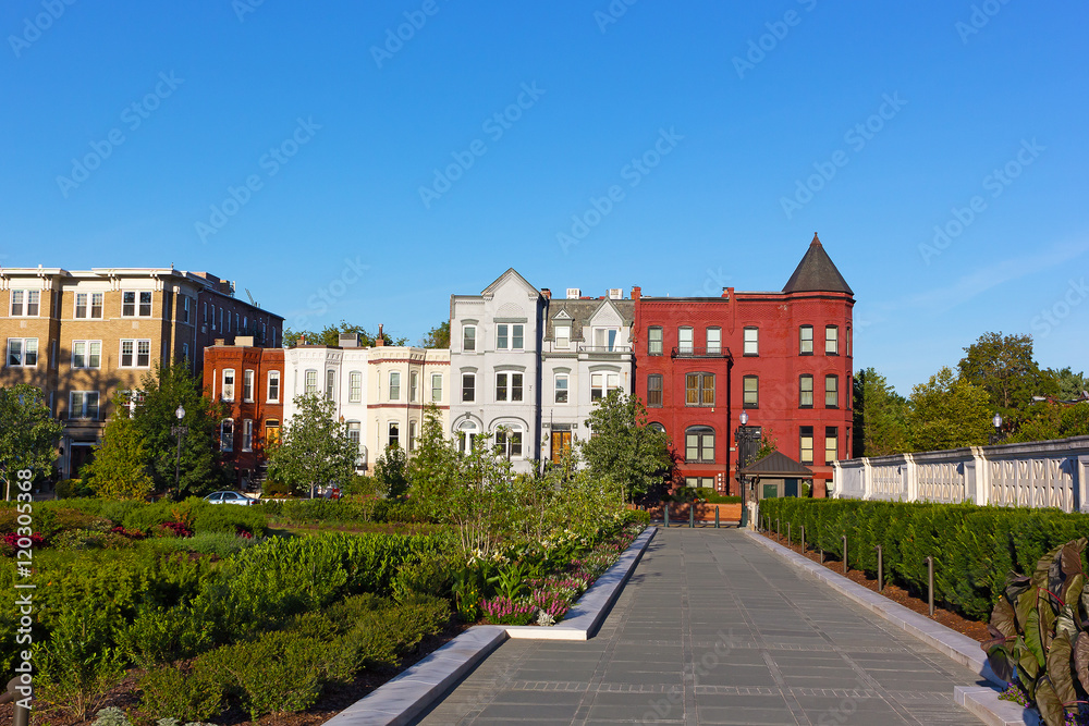 Residential architecture of North East surburb of Washington DC. Colorful row houses surronded by garden. Residential architecture of North East surburb of Washington DC. Colorful row houses surronded by garden.