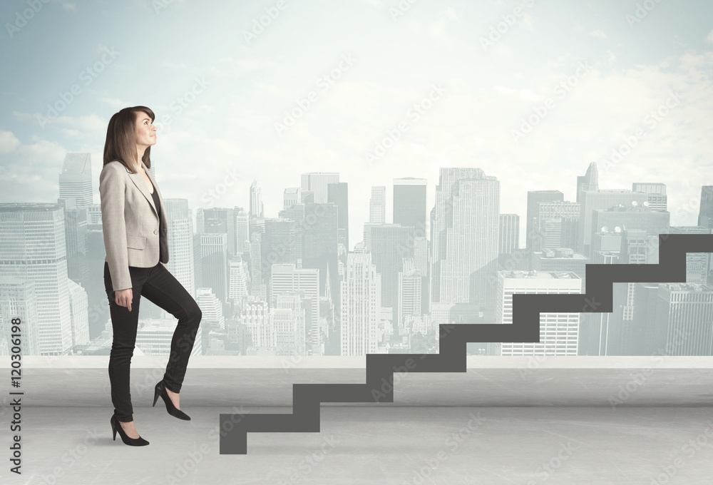 Business person in front of a staircase Business person in front of a staircase