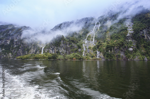 water falls in milford sound fiordland national park new zealand