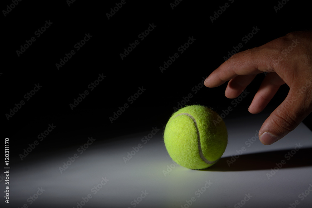 Hand Grabbing Tennis Ball