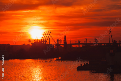 Black silhouettes of cranes and ships, Varna port