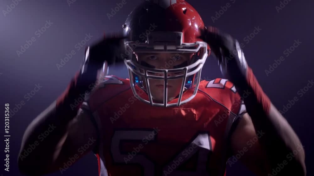 Agressive American football player looking to camera