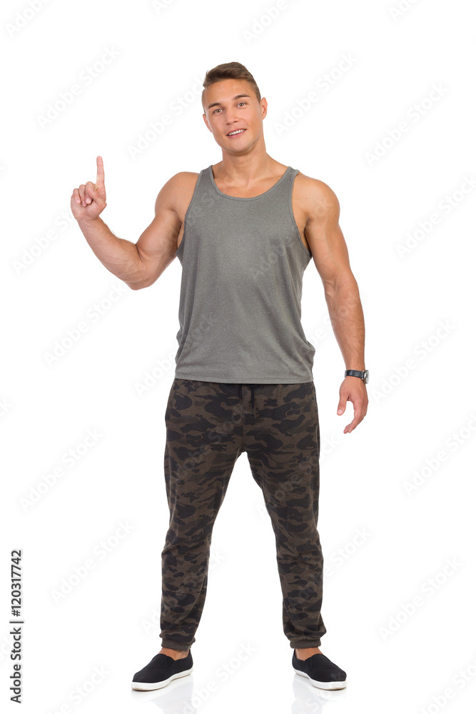 Fit Man In Camo Pants Pointing Up Fit Man In Camo Pants Pointing Up
