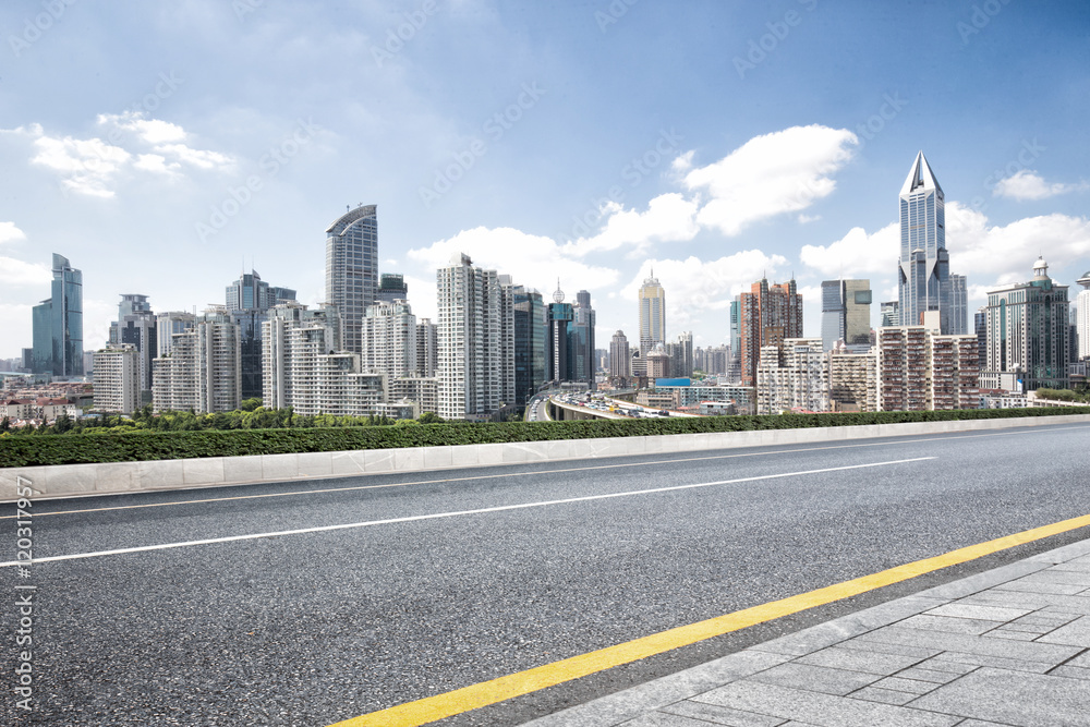cityscape and skyline of shanghai from empty road