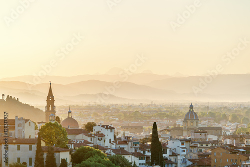 View of Florence in Tuscany at sunset with a rolling landscape