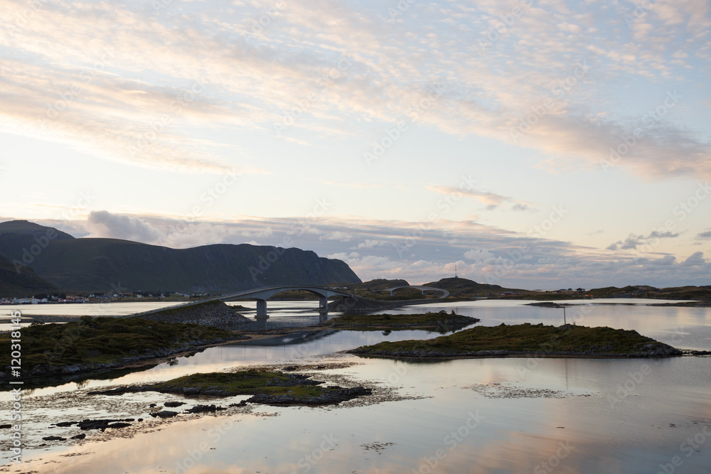 Twin bridge leading to Fredvang village, Lofoten islands, at sun