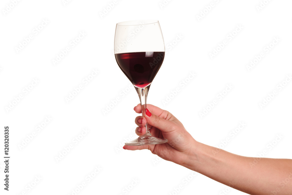 female hand with red wine glass