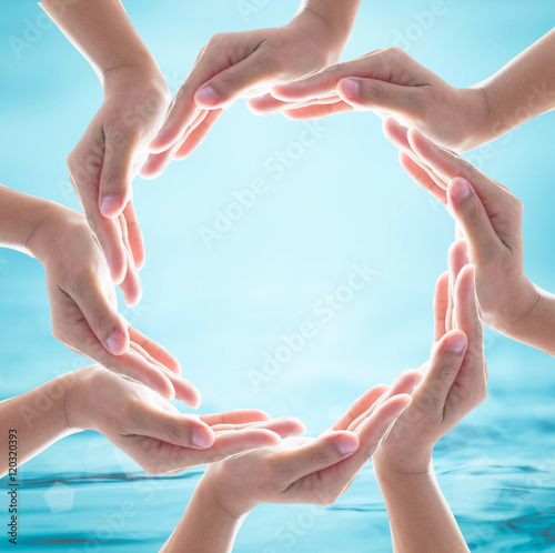 Collaborative female human hands on blurred wavy clean water background: Saving water clean natural environment ocean concept/ campaign: Love earth, save water conceptual idea/ sign