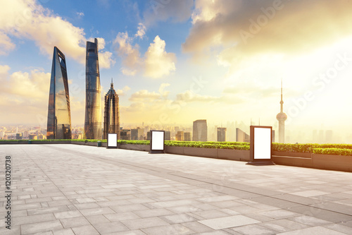 cityscape and skyline of shanghai from empty brick floor