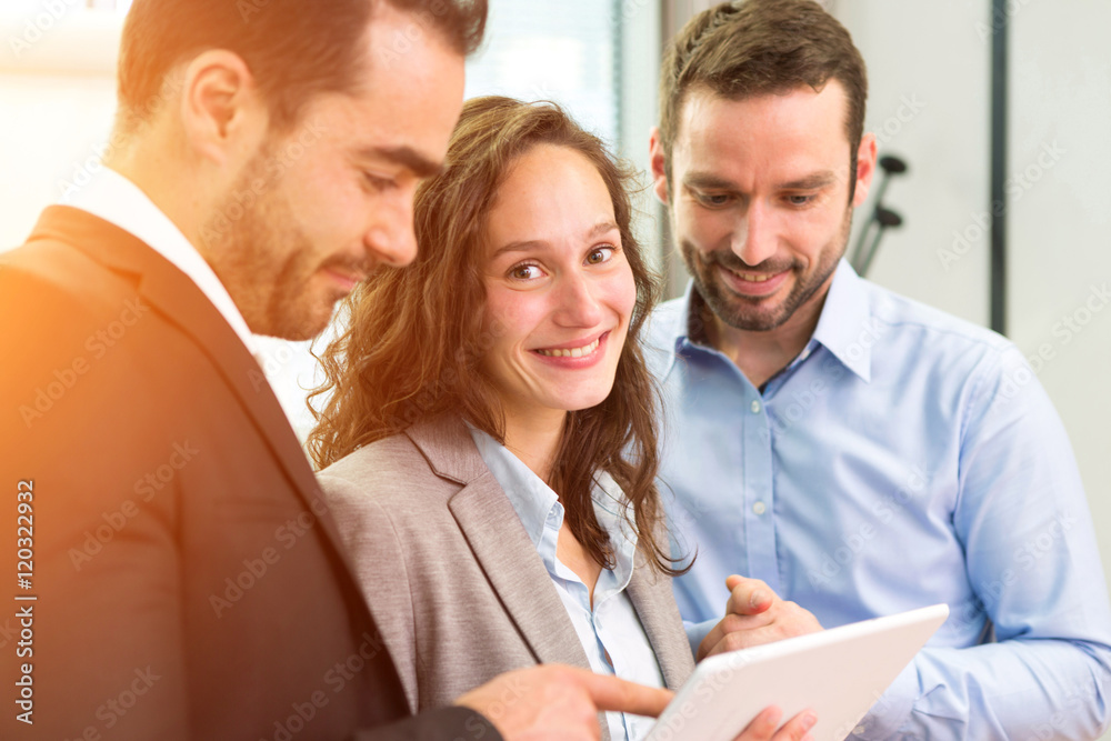 Young attractive businesswoman working at the office with associ Young attractive businesswoman working at the office with associ