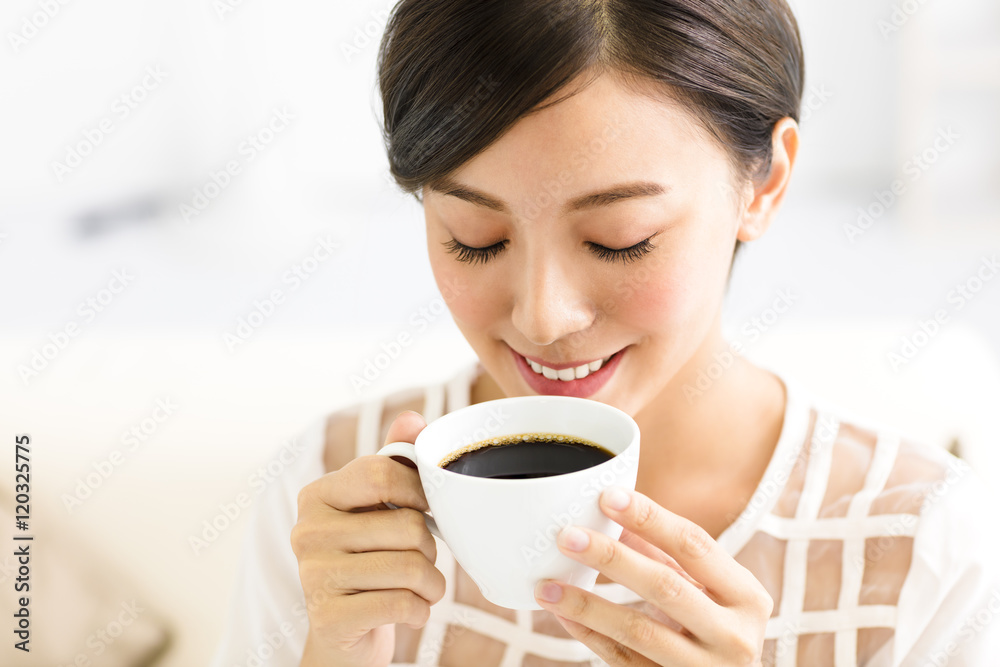 young smiling woman drinking coffee in the morning young smiling woman drinking coffee in the morning