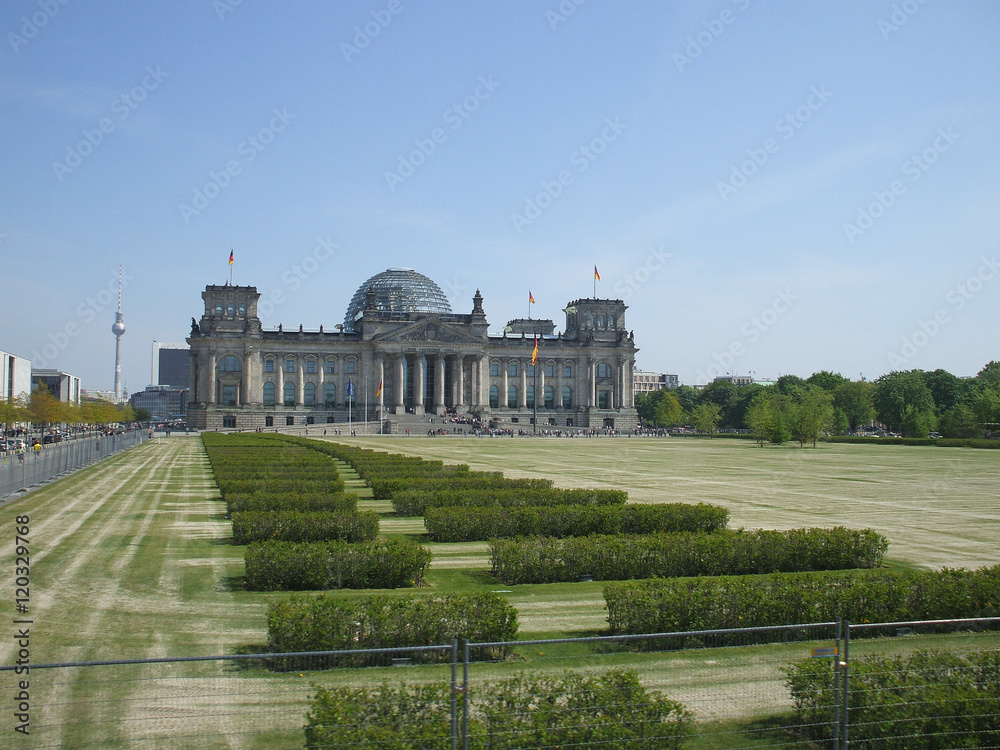 Panoramic view of famous Reichstag building, seat of the German Parliament (Deutscher Bundestag) and the front lawn