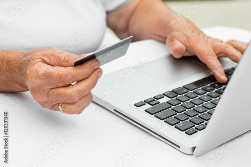 Grandmother buying online with credit card © bnenin
