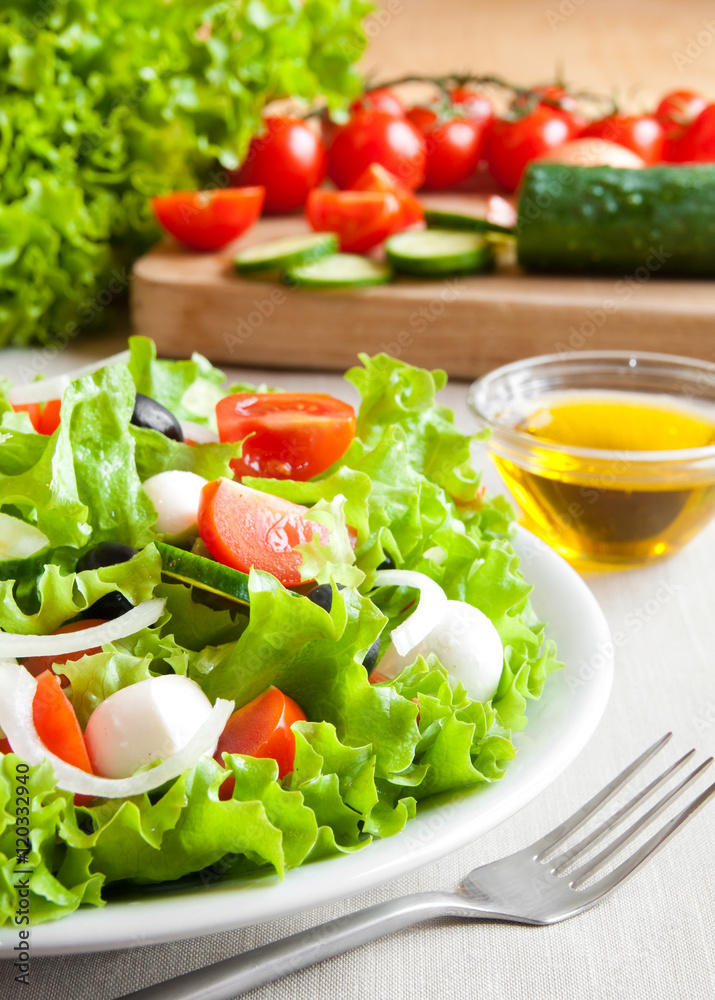 Vegetable salad in a white plate Vegetable salad in a white plate