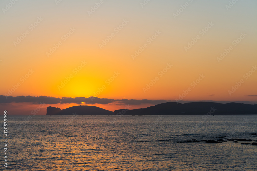 clouds over Capo Caccia at sunset