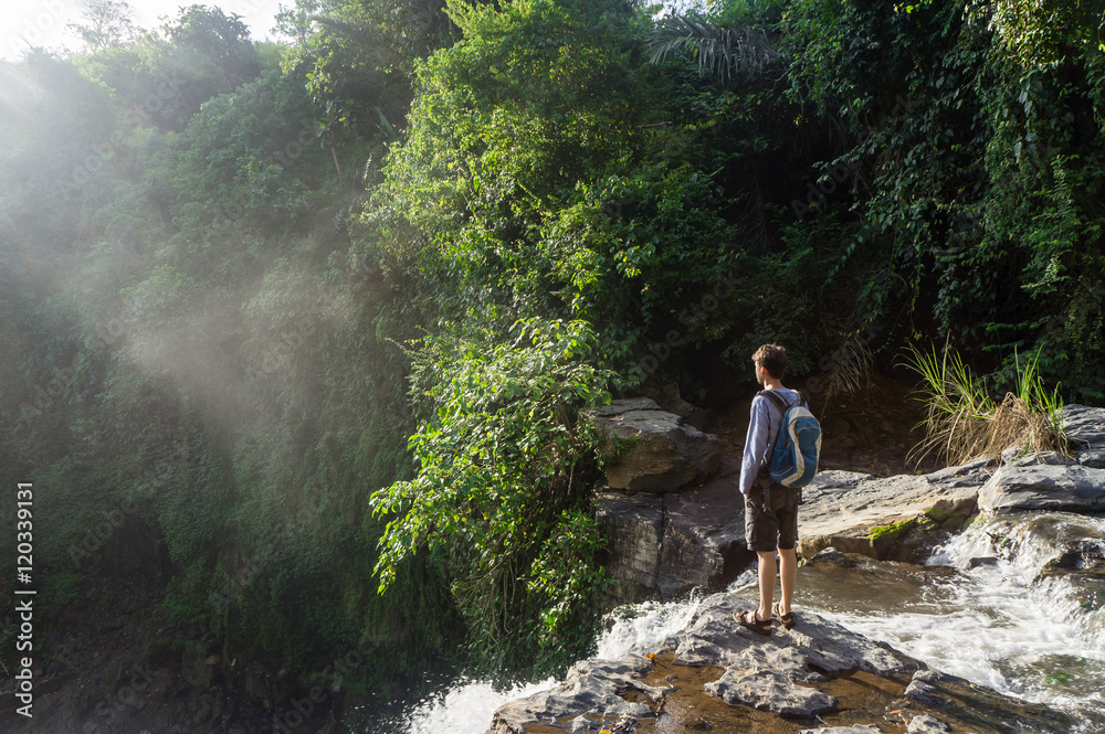 Tourist on the top of Tegenungan Waterfall, Bali, Indonesia