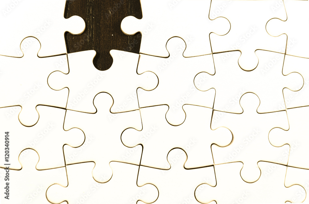 fill the gaps, white jigsaw/puzzle whit one gap, over black wooden table background, symbol of problem solving fill the gaps, white jigsaw/puzzle whit one gap, over black wooden table background, symbol of problem solving