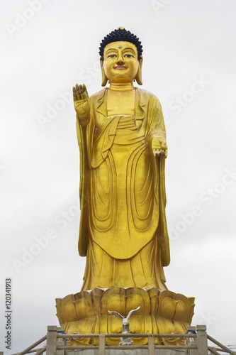 Golden statue of young Buddha near the hill Zaisan in Ulaanbaator photo