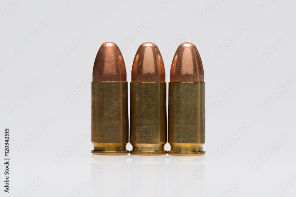 9mm bullet on the isolated white background 9mm bullet on the isolated white background