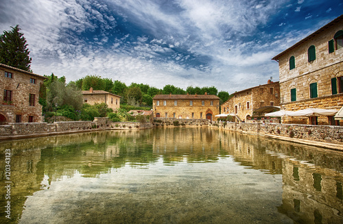 Old thermal baths in the medieval village Bagno Vignoni, Tuscany, Italy/  Spa basin in the antique italian town / Italy, Tuscany, Europe photo