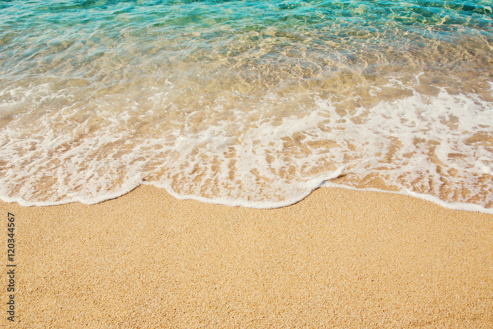 Background soft wave of Turquoise Sea with foam on sandy beach. Background soft wave of Turquoise Sea with foam on sandy beach.