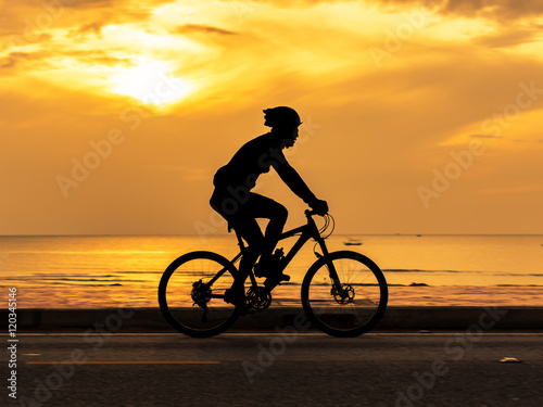 Fototapeta Naklejka Na Ścianę i Meble -  Man cycling at beach