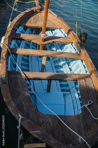 GREECE, SANTORINI - JULY 20, 2016: boat in the Greek port photo