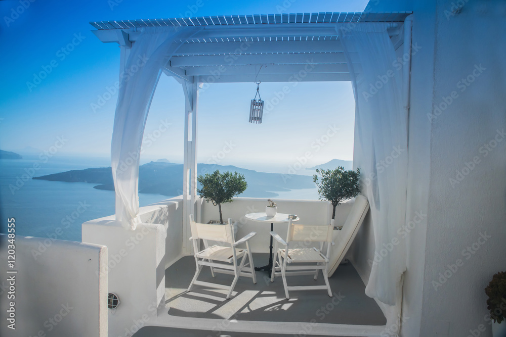 beautiful view of the sea through the white curtains on the street in Greece, Santorini