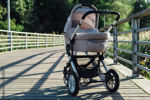 Baby stroller on running path in park