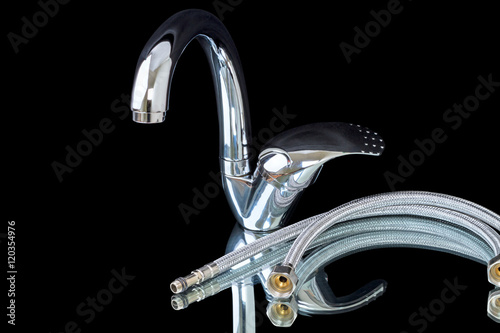 Faucet and flexible hoses on black